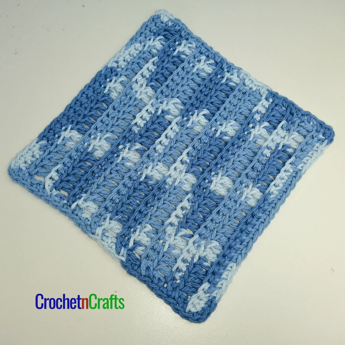 ribbed crochet dishcloth laid flat.