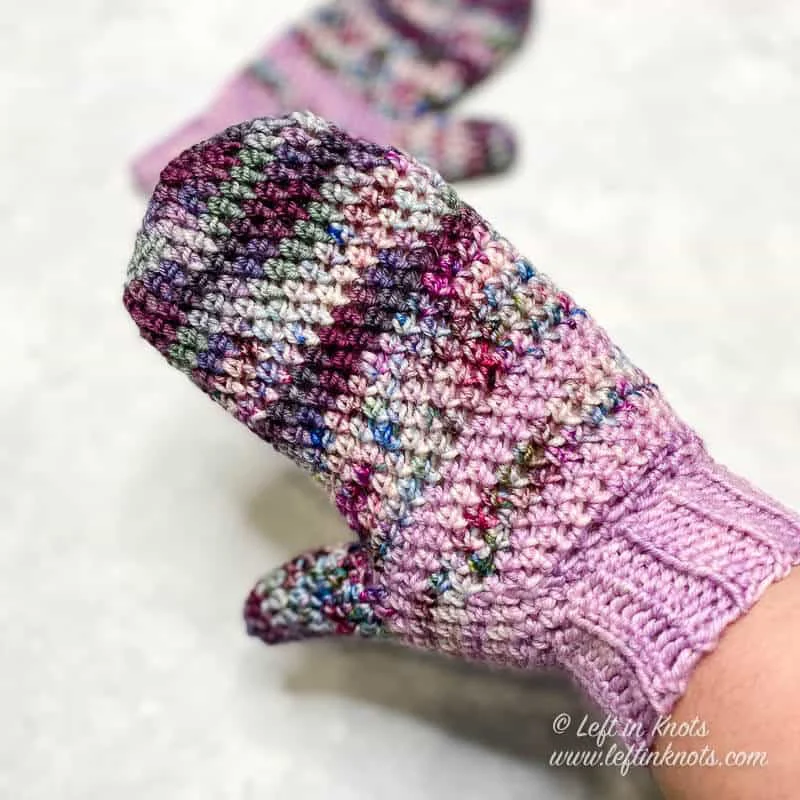 Mittens crocheted with hand dyed yarn in shades of purple