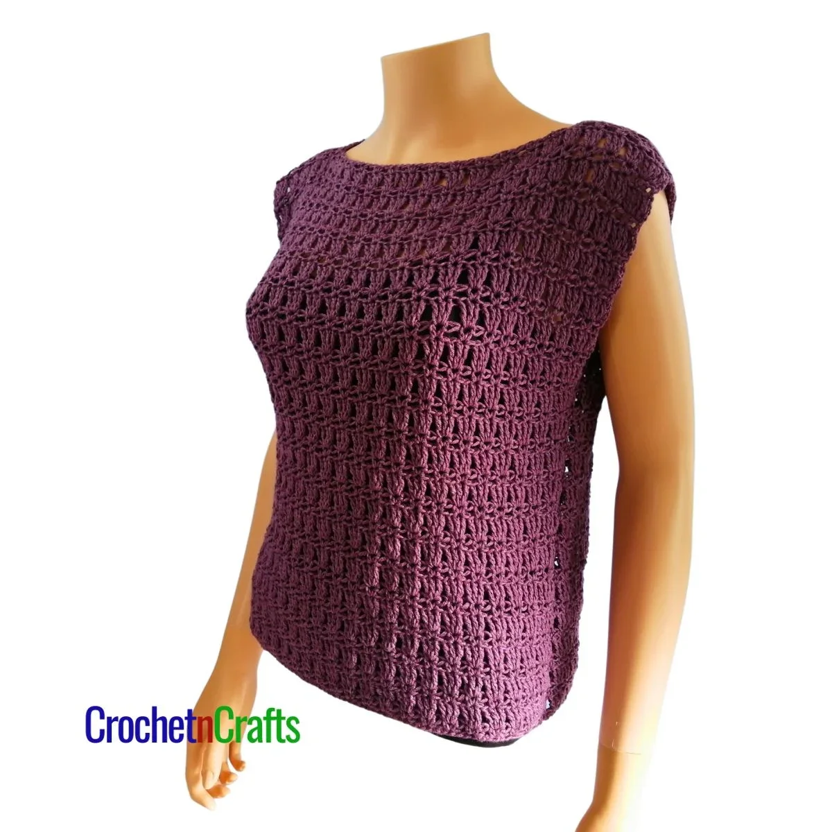 Crocheted sleeveless top modeled on a mannequin - side view