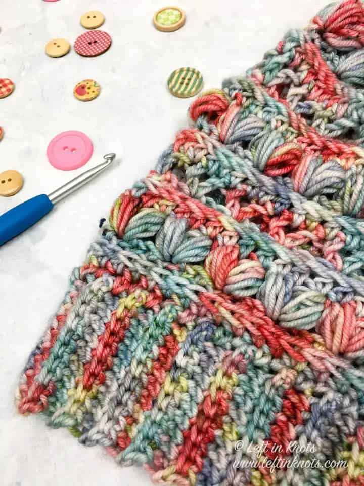 A crochet beanie made with the heart puff stitch