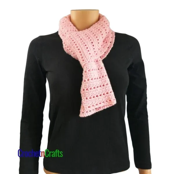 A crocheted scarf looped through for a cozy neck scarf.