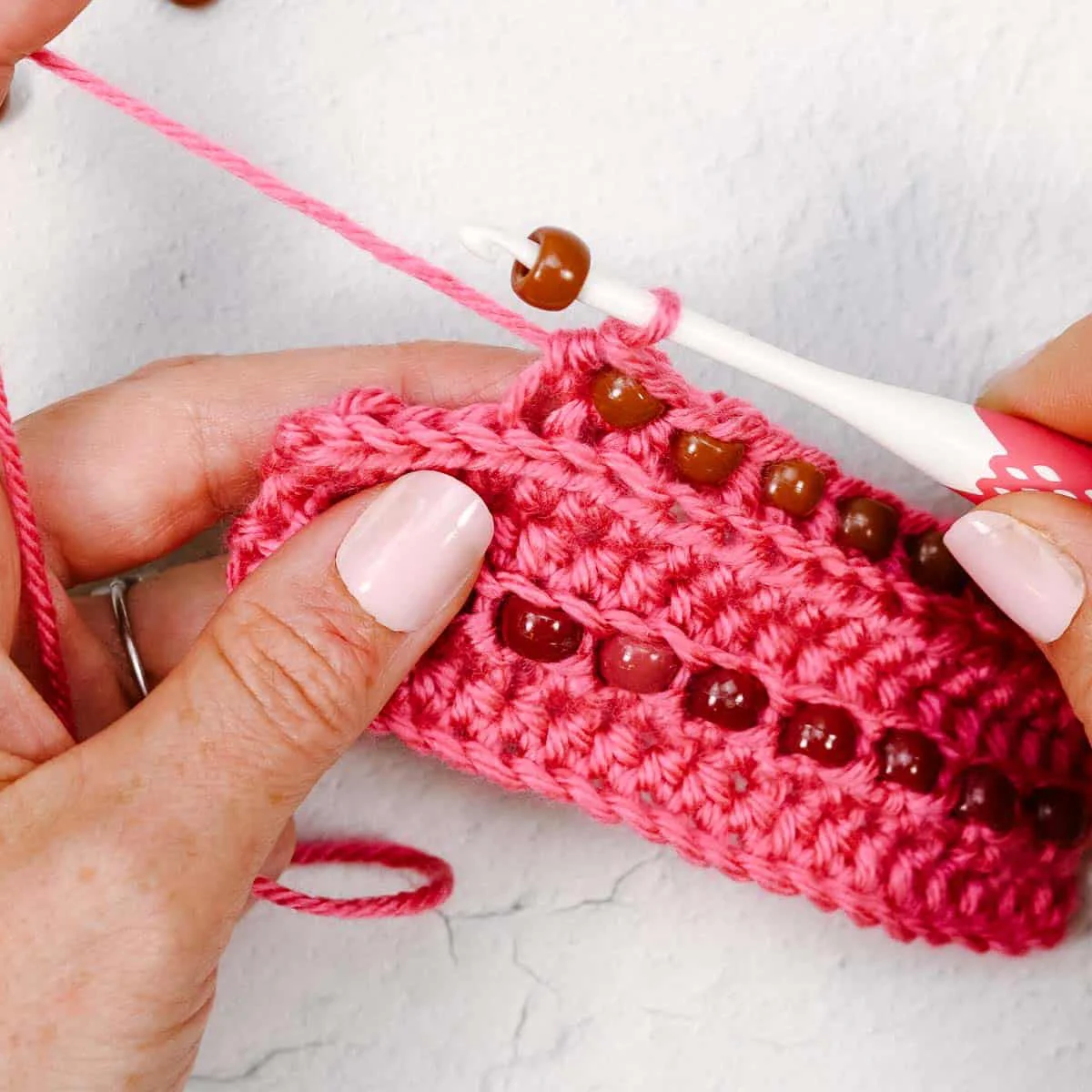 Tutorial on how to place a bead on a crochet hook. 