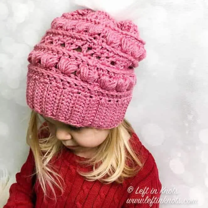 A crochet beanie made with the heart puff stitch