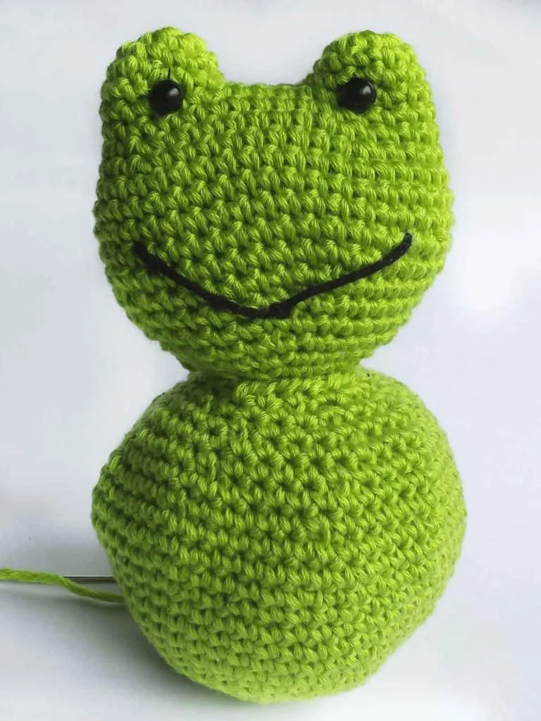 sewing together amigurumi crochet frog