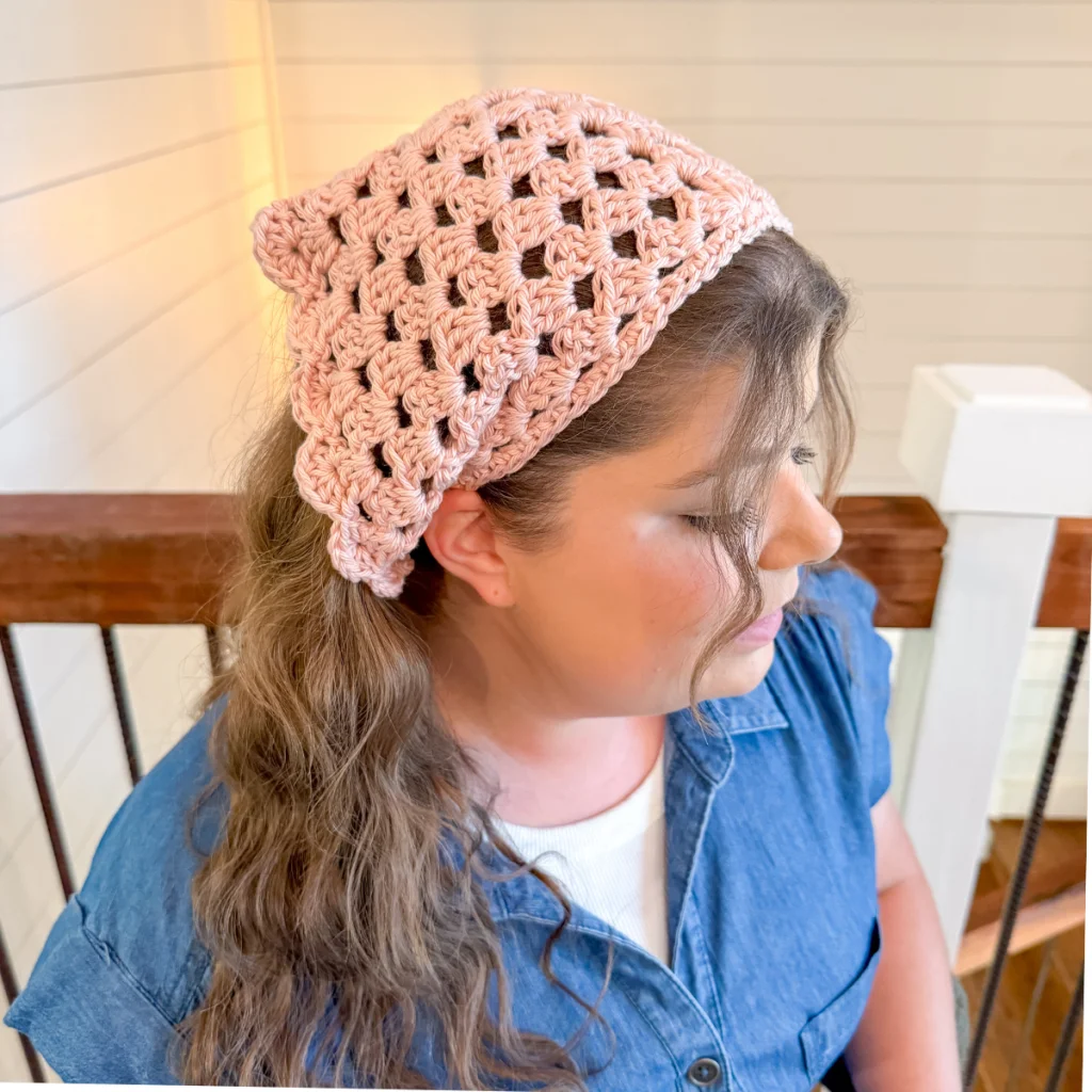 Close up of Kylee wearing a crochet granny bandana