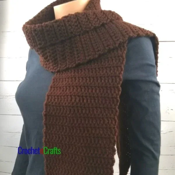 Easy crochet scarf draped over the shoulders. The scarf is worked up in single and double crochet stitches.