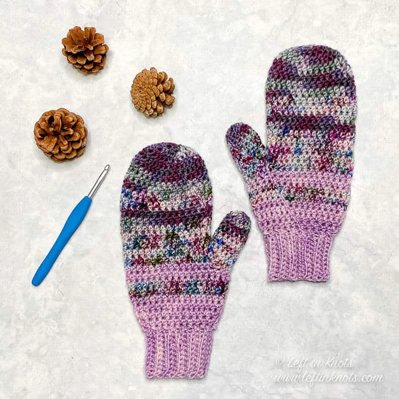 Mittens crocheted with hand dyed yarn in shades of purple