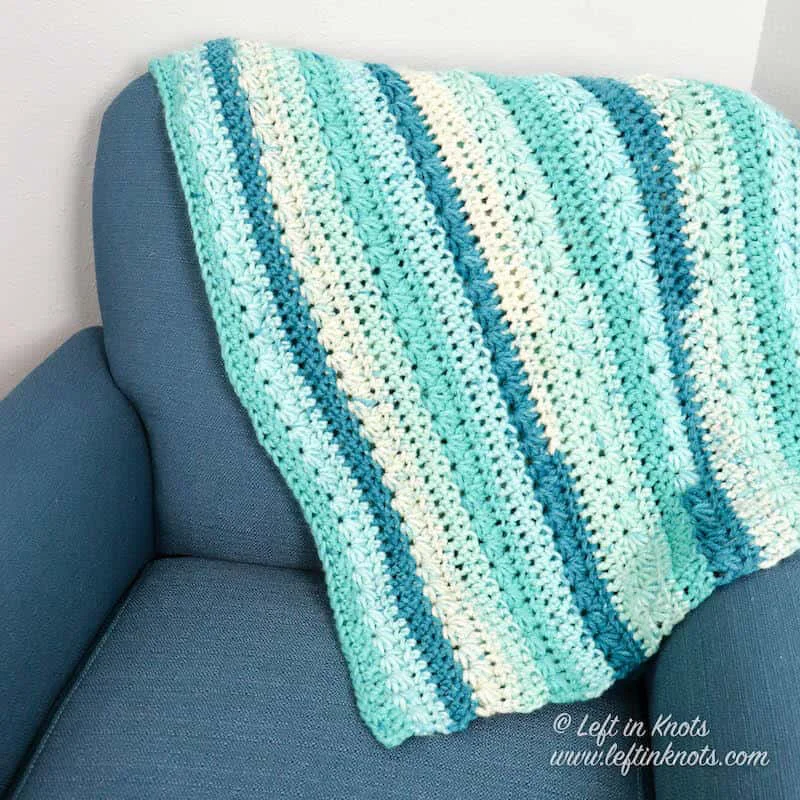 A chunky crochet blanket made with the star stitch