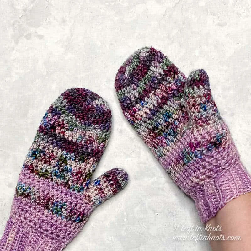 Mittens crocheted with hand dyed yarn in shades of purple